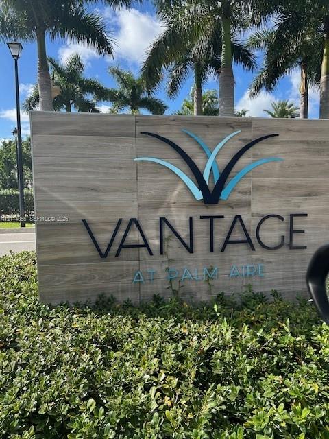 Monolithic signage featuring wood-grain cladding, three-dimensional dimensional lettering, and integrated landscaping Monolithic signage featuring wood-grain cladding, three-dimensional dimensional lettering, and integrated landscaping