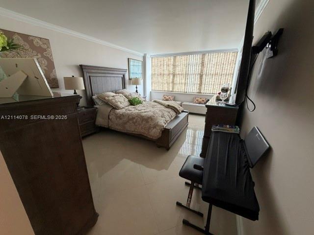 Large-format tile flooring, crown molding, and floor-to-ceiling windows featuring vertical blinds