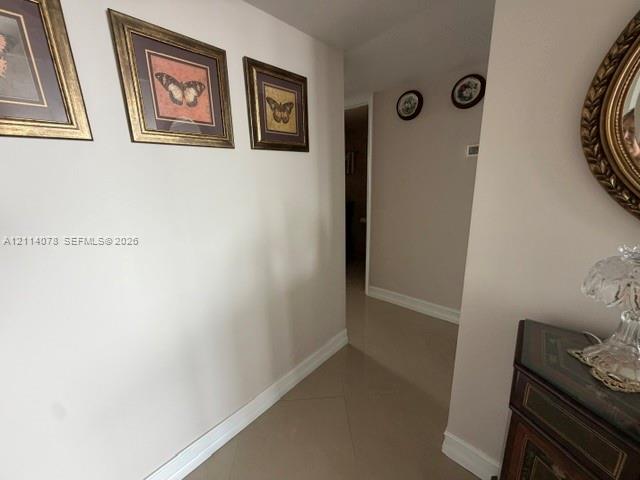 Neutral wall palette and large-format tile flooring