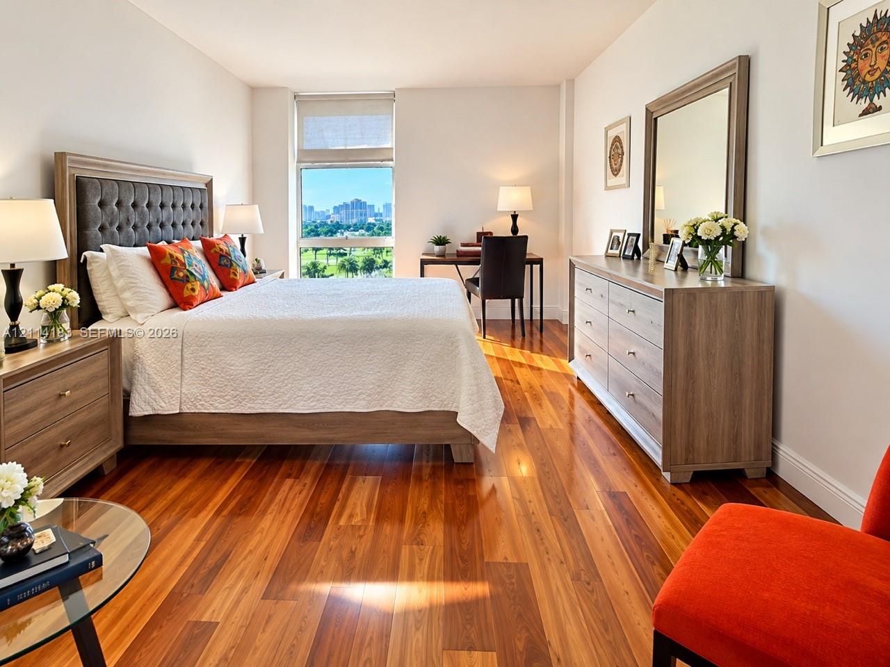 Polished wood-finish flooring, tall windows, and neutral wall tones