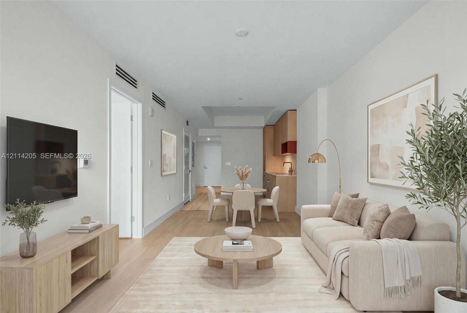 Open-concept interior featuring light wood-finish flooring, recessed lighting, and a modern kitchen with flat-panel cabinetry - staged Open-concept interior featuring light wood-finish flooring, recessed lighting, and a modern kitchen with flat-panel cabinetry - staged