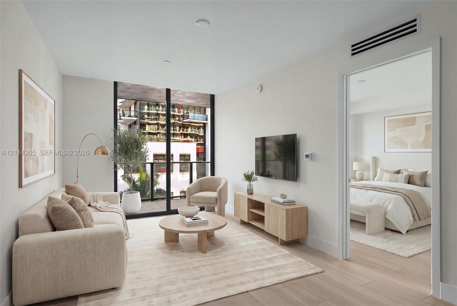 Floor-to-ceiling windows, wood-finish flooring, and a private balcony Floor-to-ceiling windows, wood-finish flooring, and a private balcony