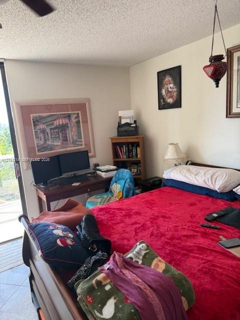 Room featuring a glass sliding door and ceramic tile flooring