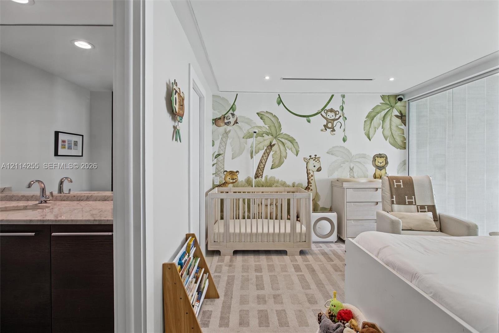 Room featuring floor-to-ceiling windows, custom wall mural, recessed lighting, and wall-to-wall carpeting