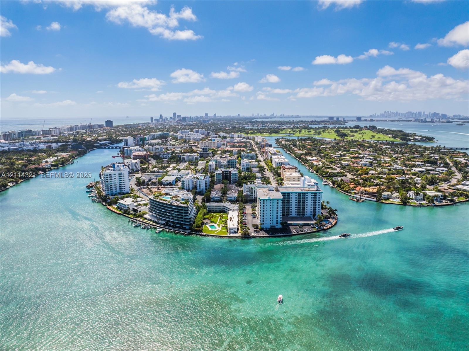 Aerial perspective of waterfront peninsula featuring coastal architecture, surrounding maritime waterways, and prominent shoreline positioning