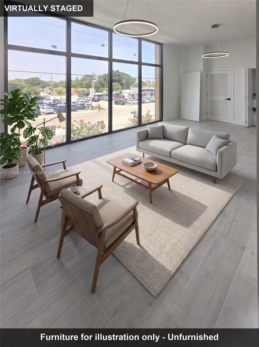 Floor-to-ceiling windows, wood-finish tile flooring, and minimalist circular pendant lighting