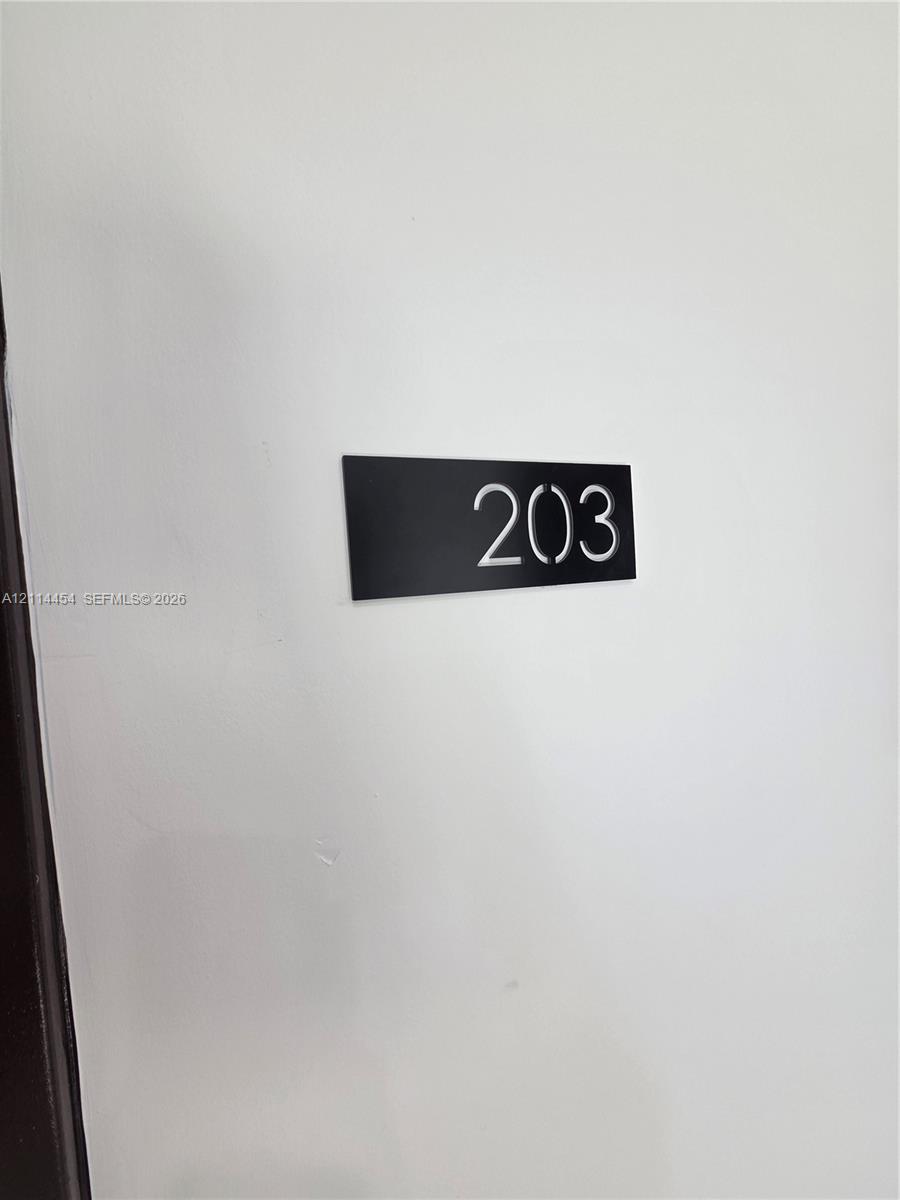 Minimalist black rectangular signage featuring high-contrast white numerals