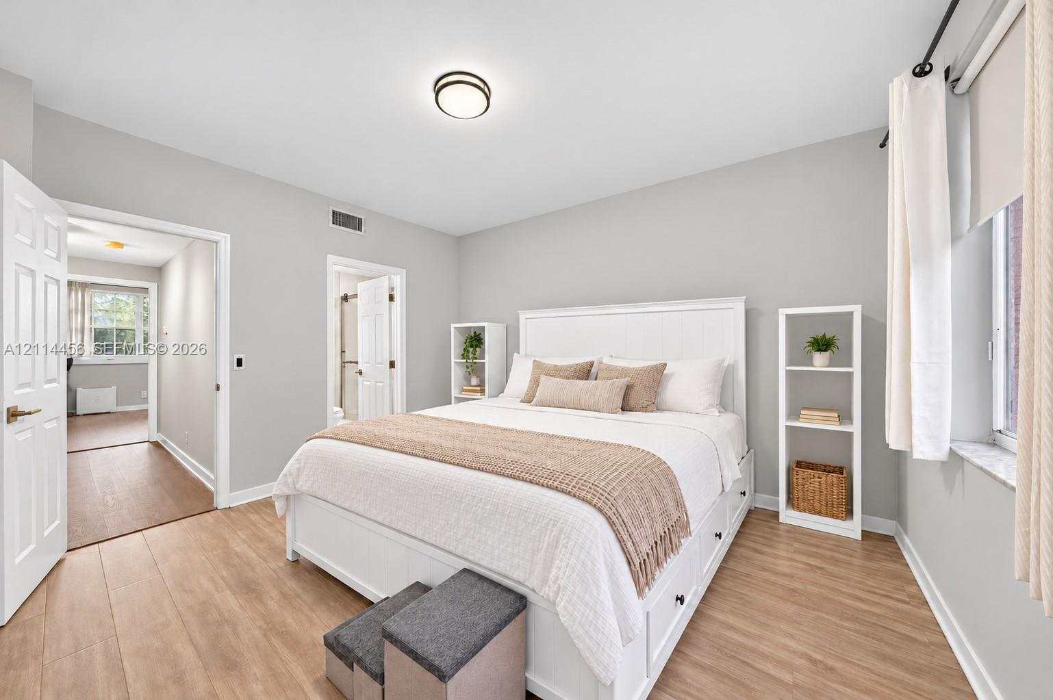 Neutral paint finish, wood-finish flooring, and flush-mount ceiling lighting