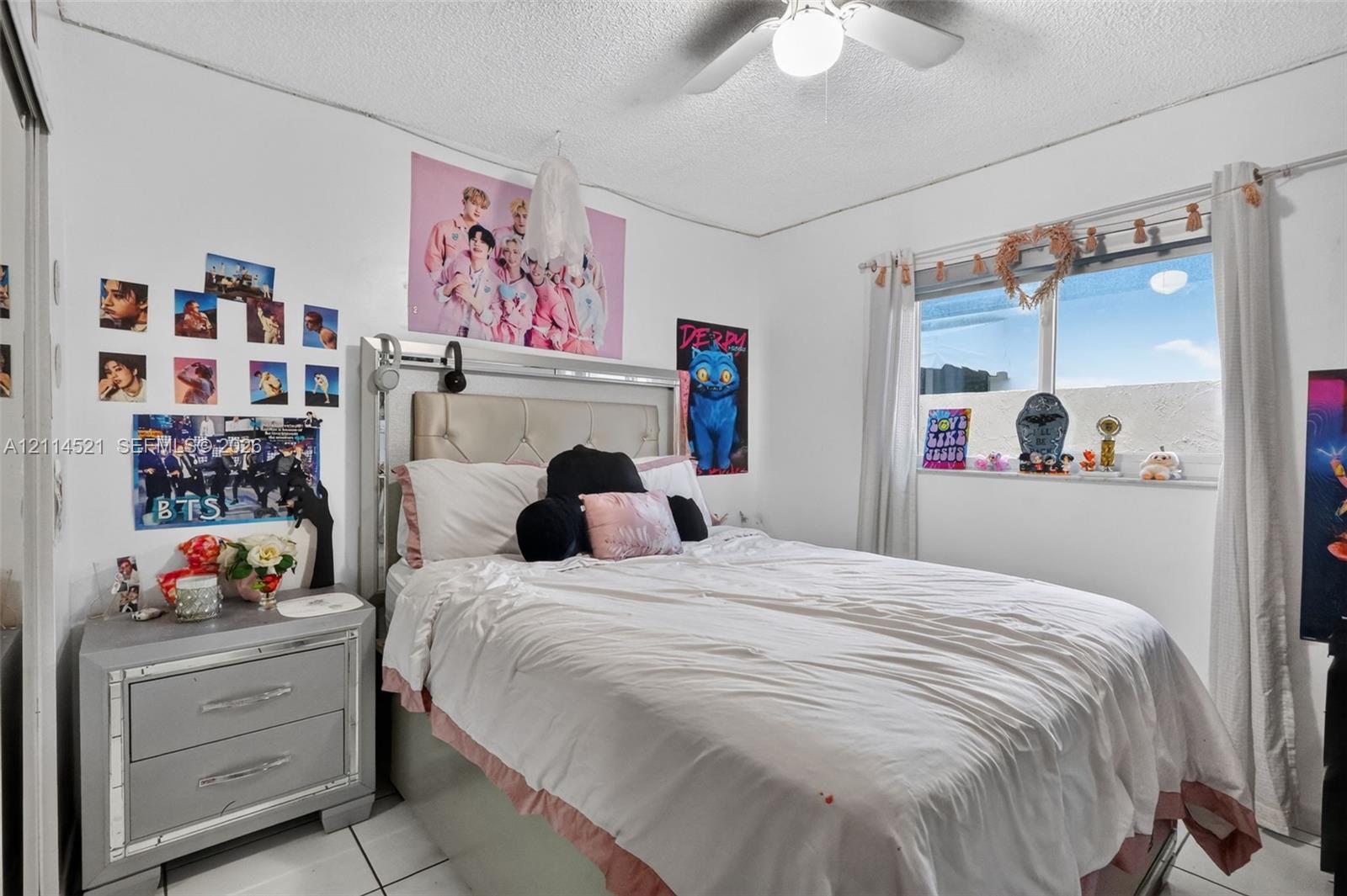 Tile flooring, horizontal sliding window, and ceiling-mounted light fixture with fan