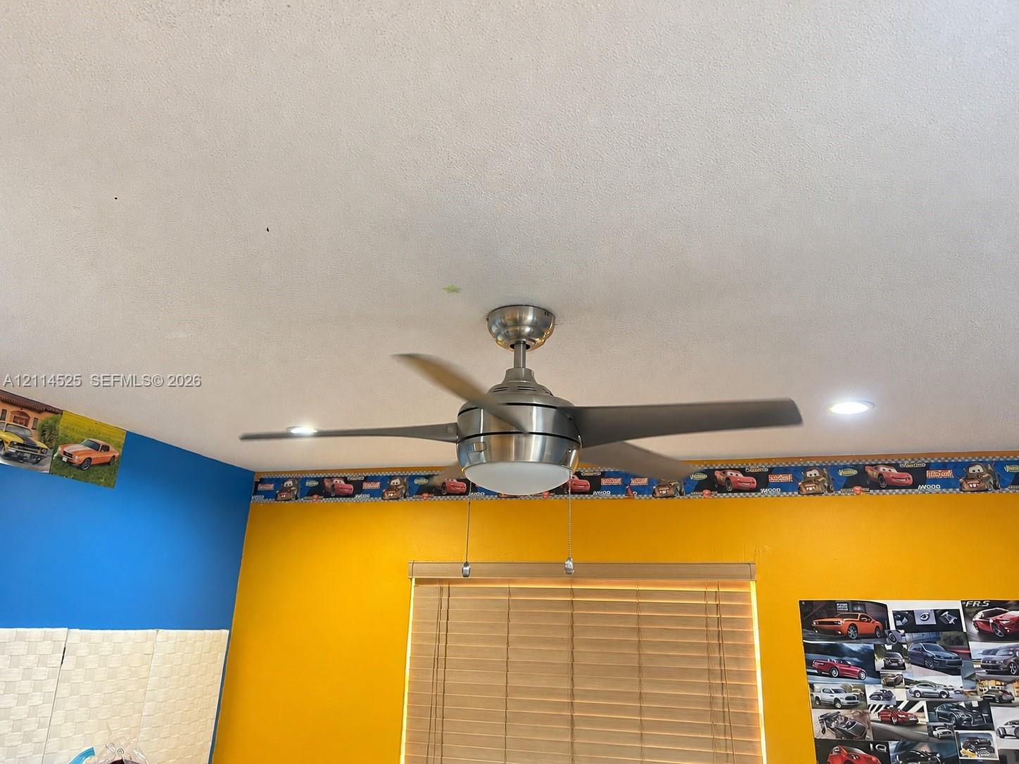 Brushed nickel ceiling fan with integrated light fixture and recessed lighting