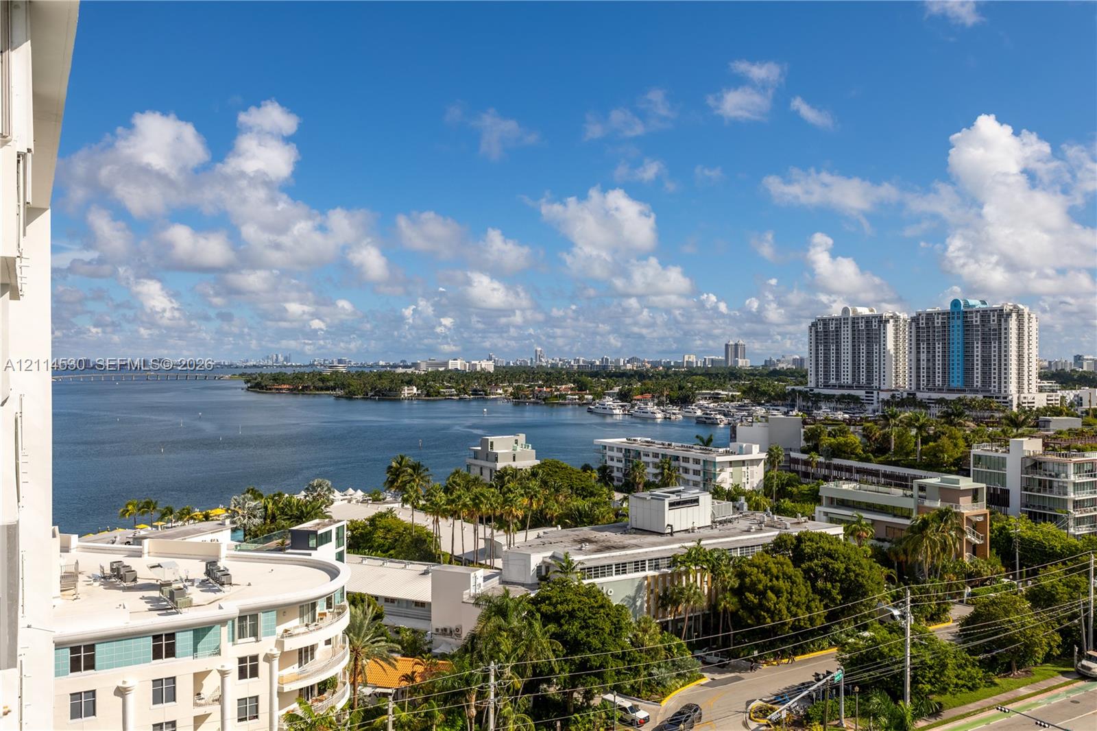 Elevated perspective showcasing coastal scenery, expansive water, and urban landscape
