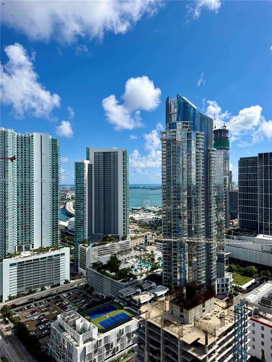 Elevated urban landscape featuring high-rise architecture, deep water access, and open horizon
