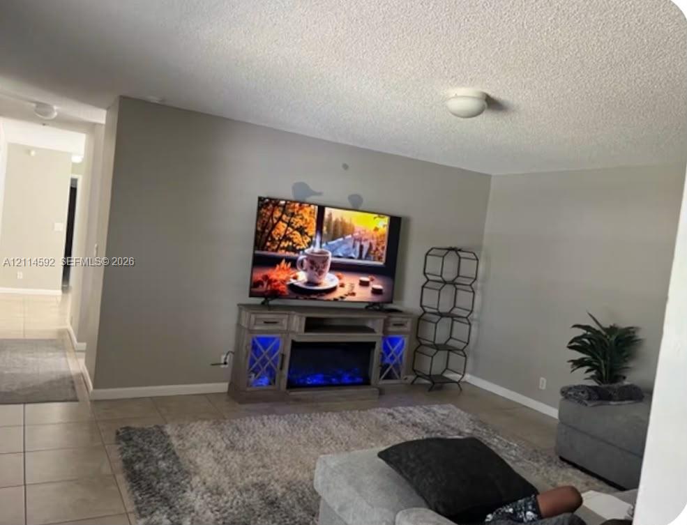 Neutral-toned walls and neutral-colored tile flooring Neutral-toned walls and neutral-colored tile flooring