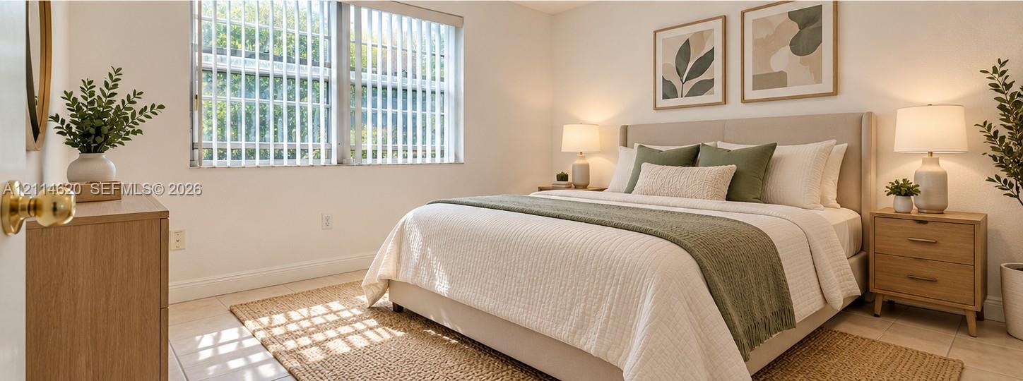 Neutral-toned walls, large window with vertical blinds, and polished tile flooring