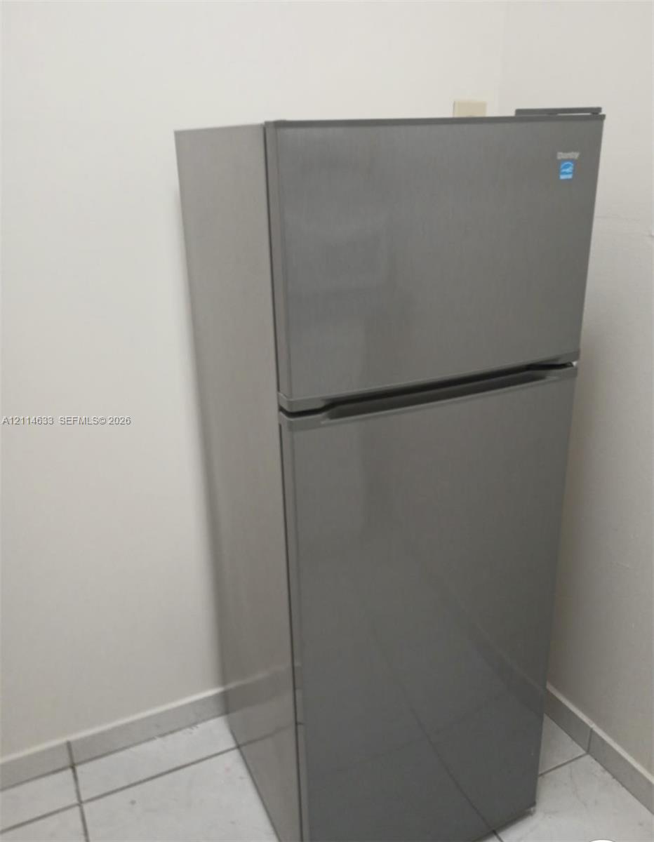 Top-mount refrigerator featuring a stainless-steel finish and Energy Star certification