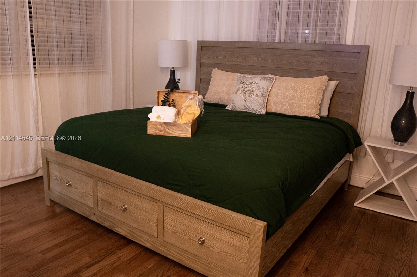 Wood-finish flooring throughout and horizontal blind window coverings