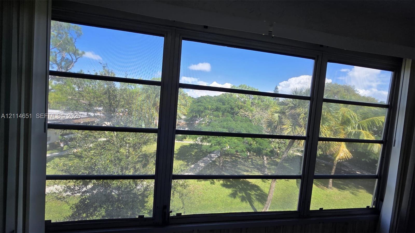 Multi-pane horizontal sliding windows with dark metal frames and screening Multi-pane horizontal sliding windows with dark metal frames and screening