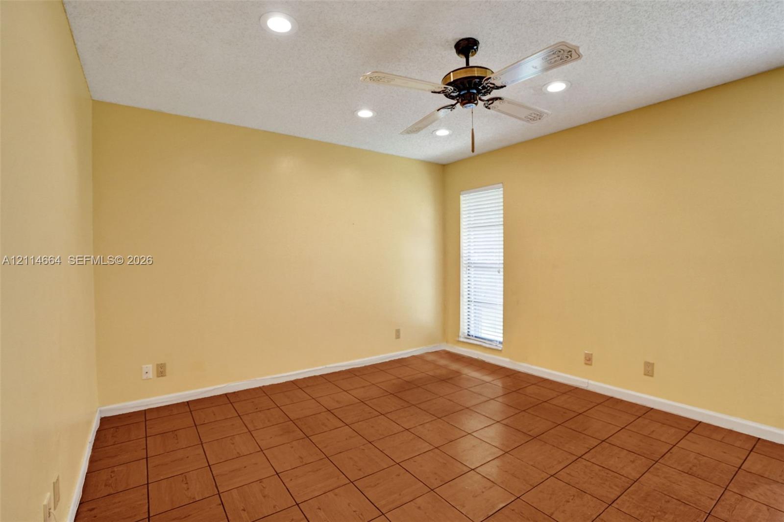 Ceramic tile flooring, ceiling fan with integrated light fixture, and recessed lighting