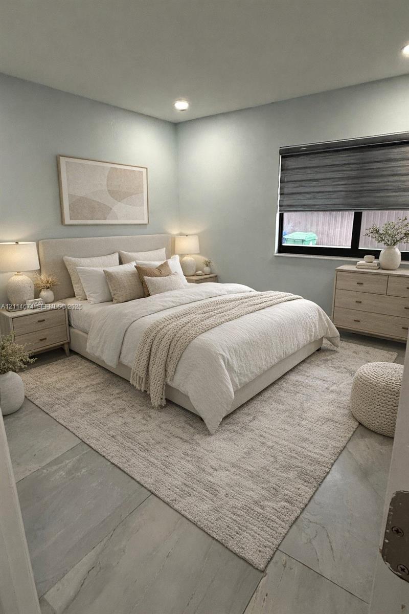 Neutral-toned room featuring large-format tile flooring, recessed lighting, and a window with a dark-framed sliding sash Neutral-toned room featuring large-format tile flooring, recessed lighting, and a window with a dark-framed sliding sash