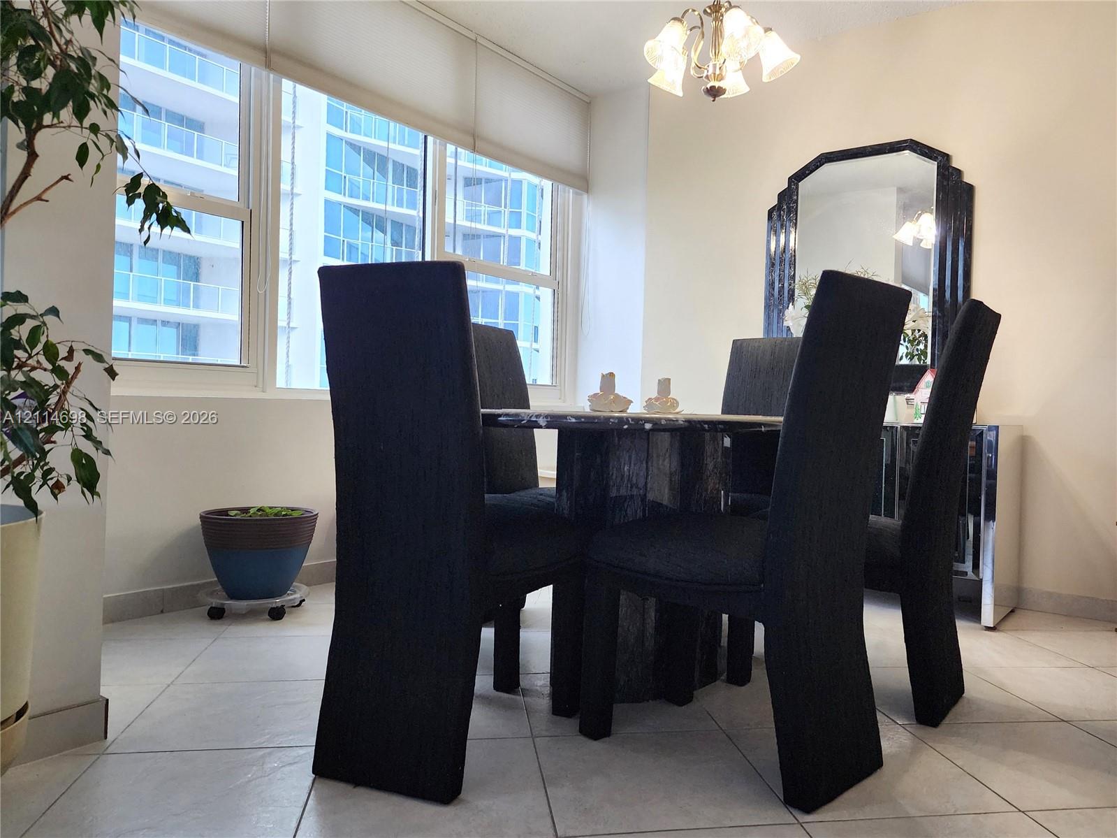 Large-format tile flooring, oversized windows with roller shades