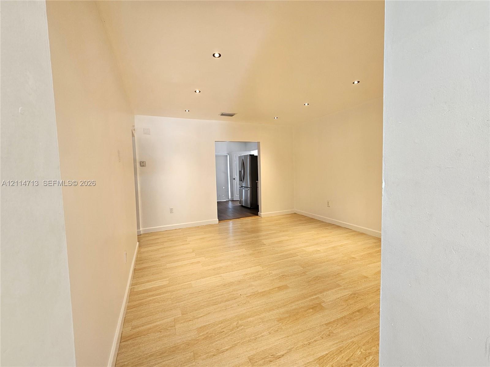Interior space featuring wood-finish flooring and recessed ceiling lighting