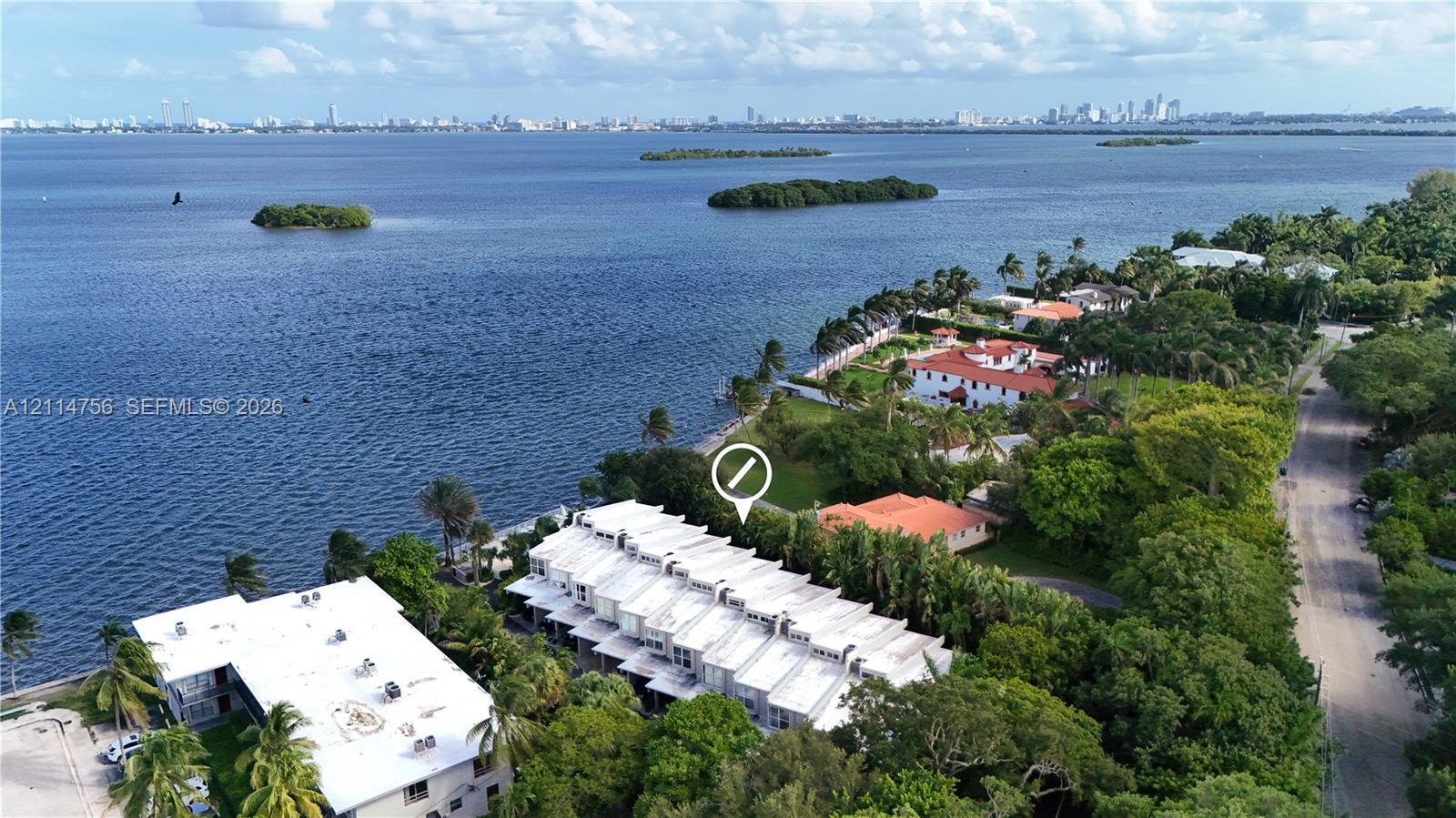Waterfront townhome community featuring multi-level architecture, flat rooflines, and expansive shoreline access Waterfront townhome community featuring multi-level architecture, flat rooflines, and expansive shoreline access