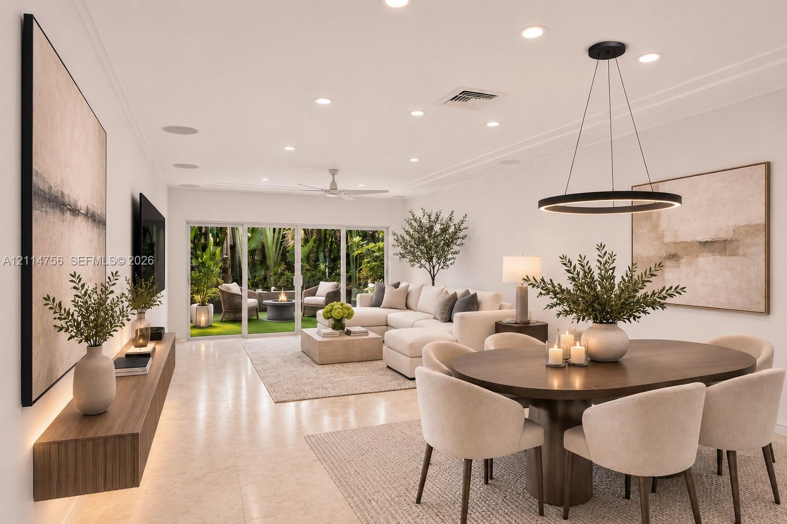 Open-concept living space featuring large-format tile flooring, recessed lighting, a modern circular LED pendant fixture, and a floating wood-finish media console with integrated under-cabinet lighting Open-concept living space featuring large-format tile flooring, recessed lighting, a modern circular LED pendant fixture, and a floating wood-finish media console with integrated under-cabinet lighting