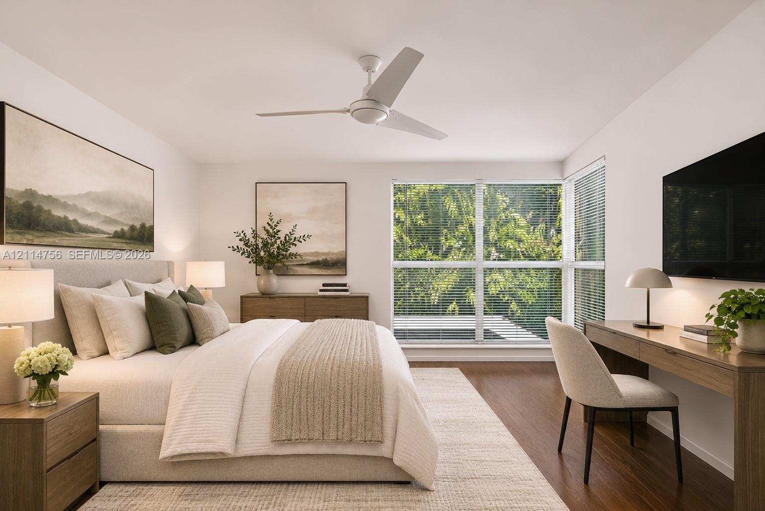 Wood-finish flooring, large windows with horizontal blinds, and a white ceiling fan