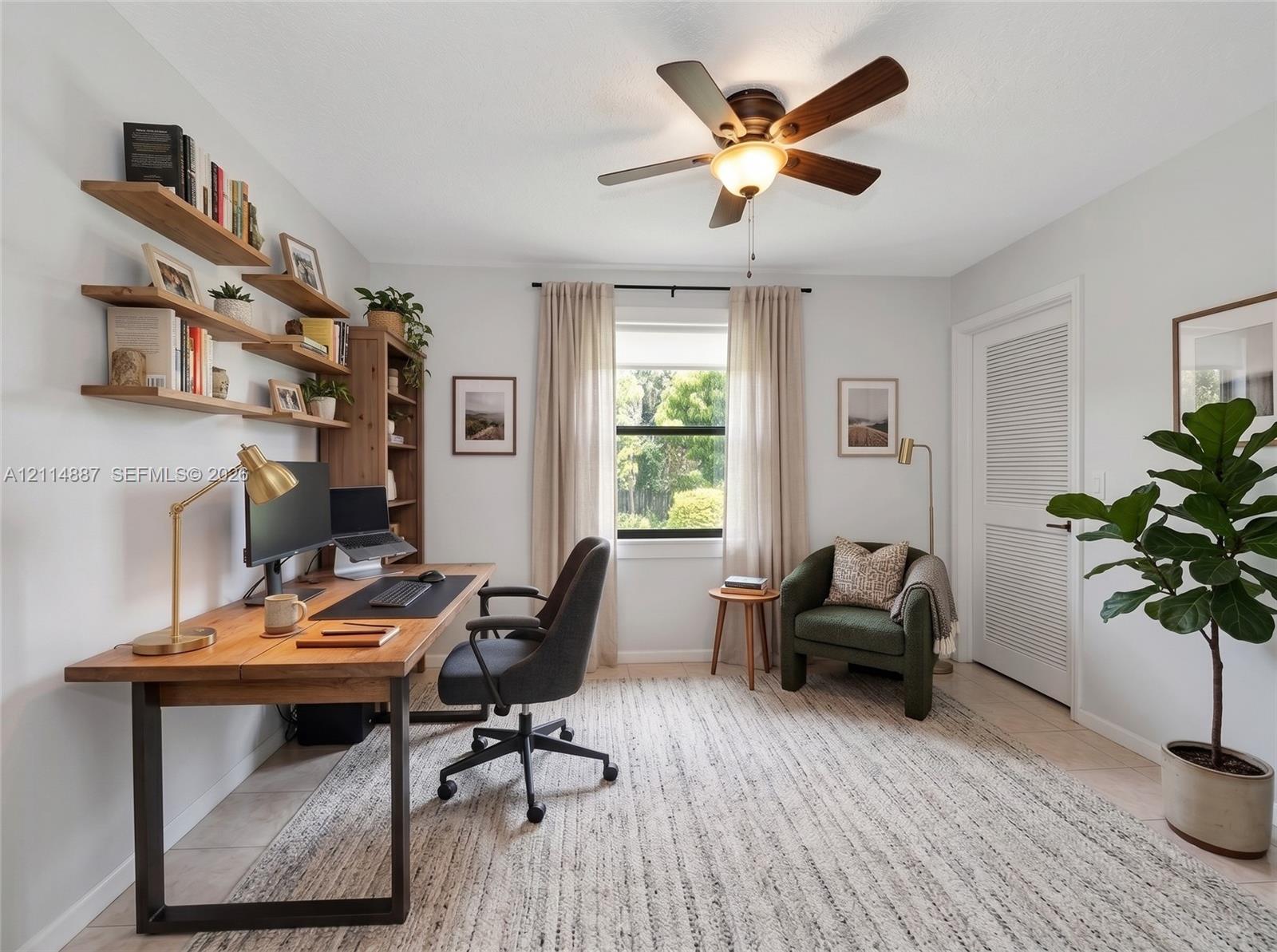 Wall-mounted natural wood shelving, ceiling fan with integrated lighting, and louvered door