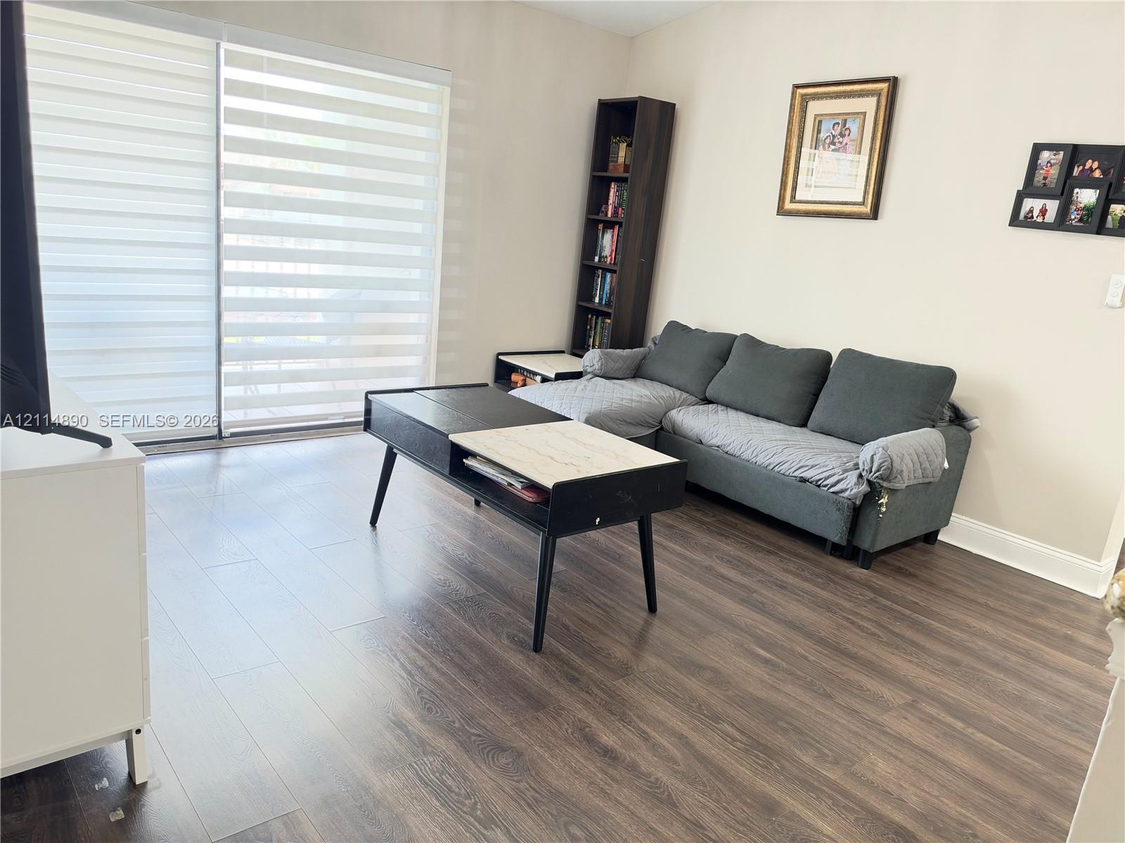 Wood-finish flooring and sliding glass door with integrated horizontal blinds