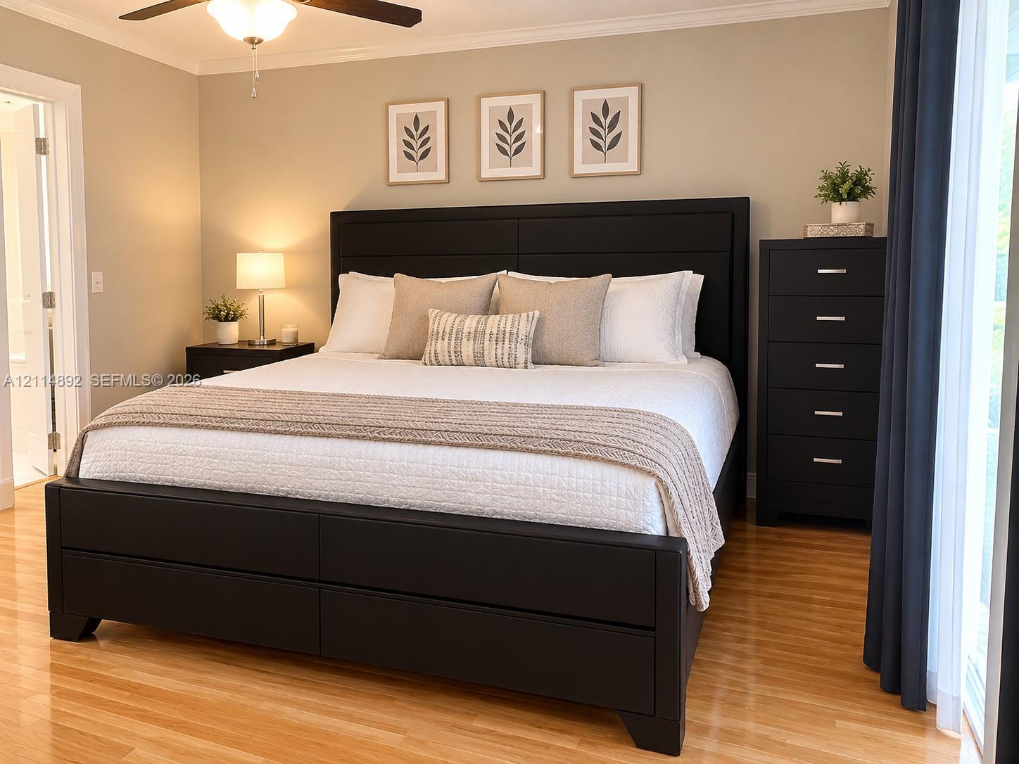 Neutral wall tones, wood-finish flooring, and a ceiling fan with integrated lighting
