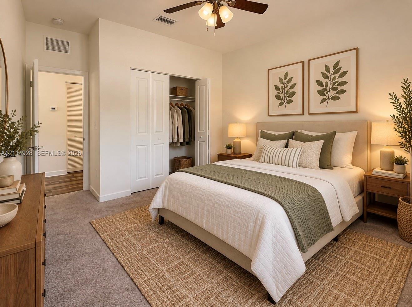 Neutral carpeting, ceiling fan with integrated lighting, and dual-door closet featuring built-in shelving
