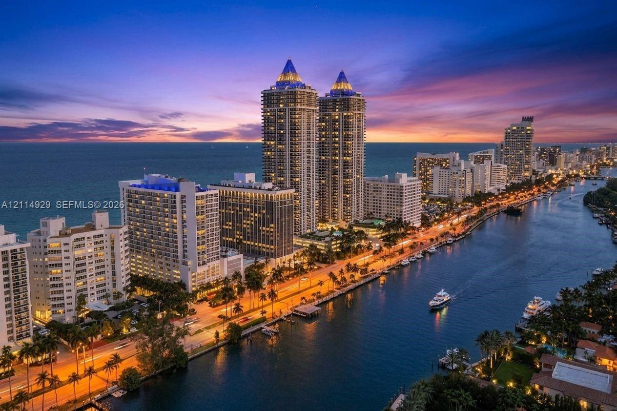 High-rise towers situated along a coastal waterway featuring marina access and panoramic waterfront scenery High-rise towers situated along a coastal waterway featuring marina access and panoramic waterfront scenery