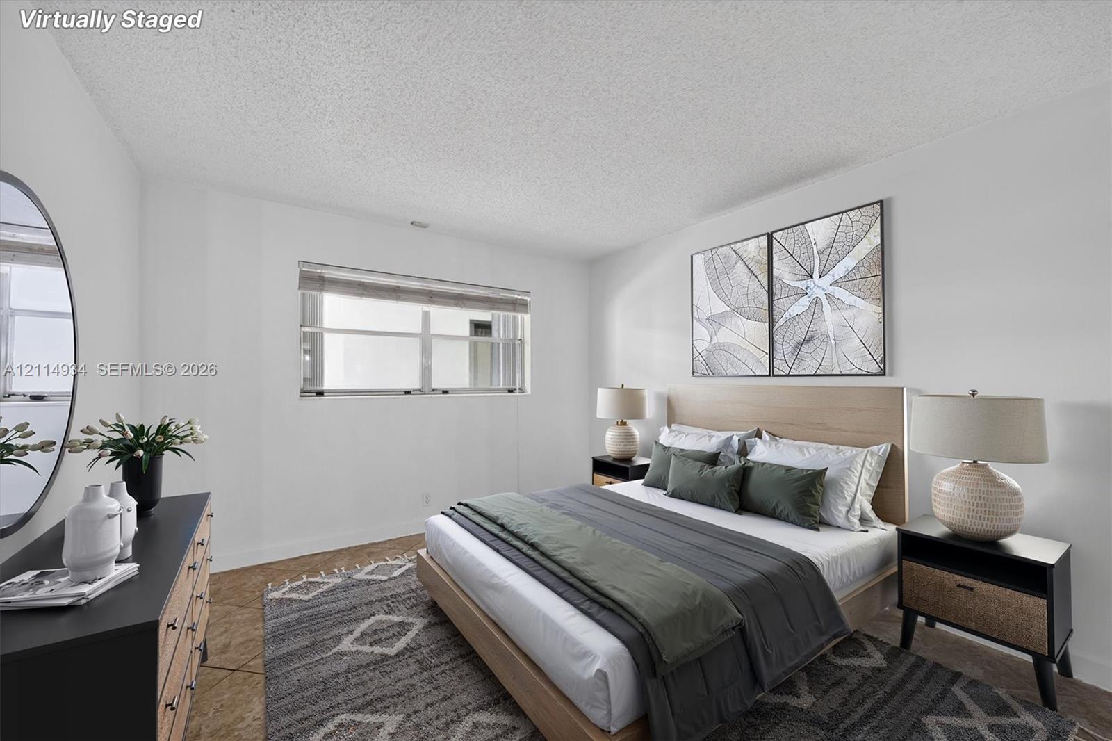 Neutral interior featuring textured wall-to-wall carpeting and a horizontal sliding window