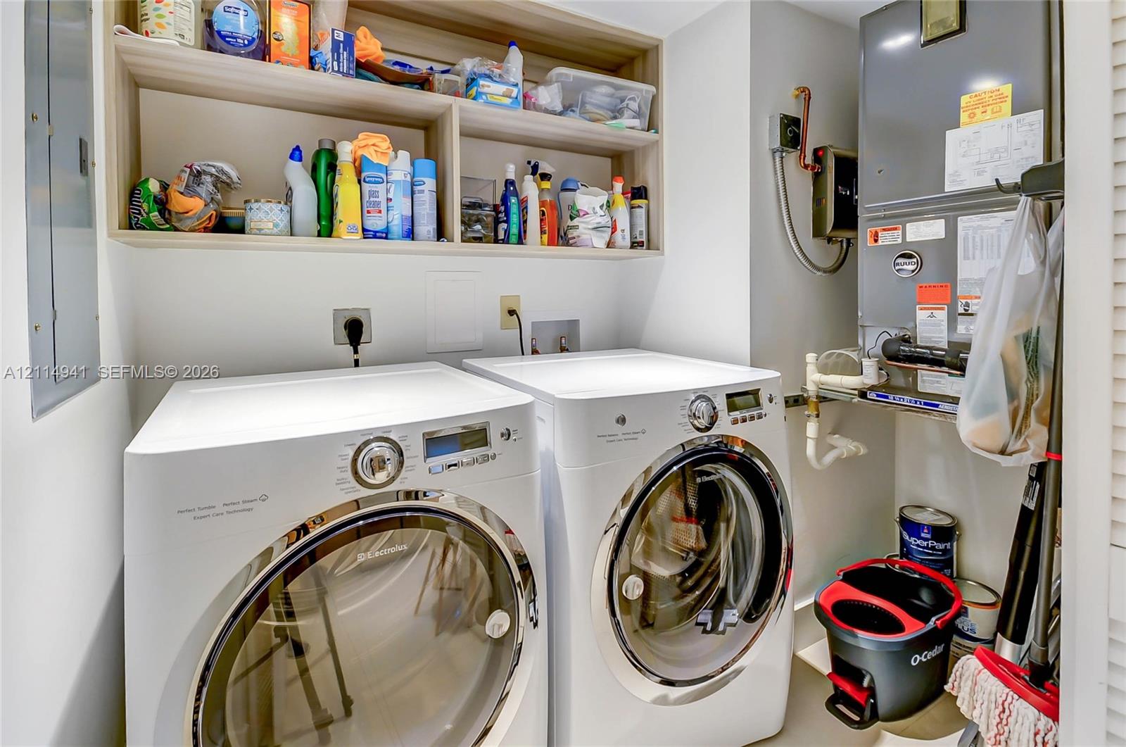 Built-in wood-finish overhead shelving and high-efficiency appliance hookups