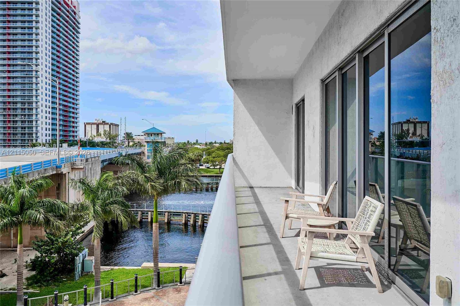 Private balcony featuring concrete flooring and floor-to-ceiling glass sliding doors