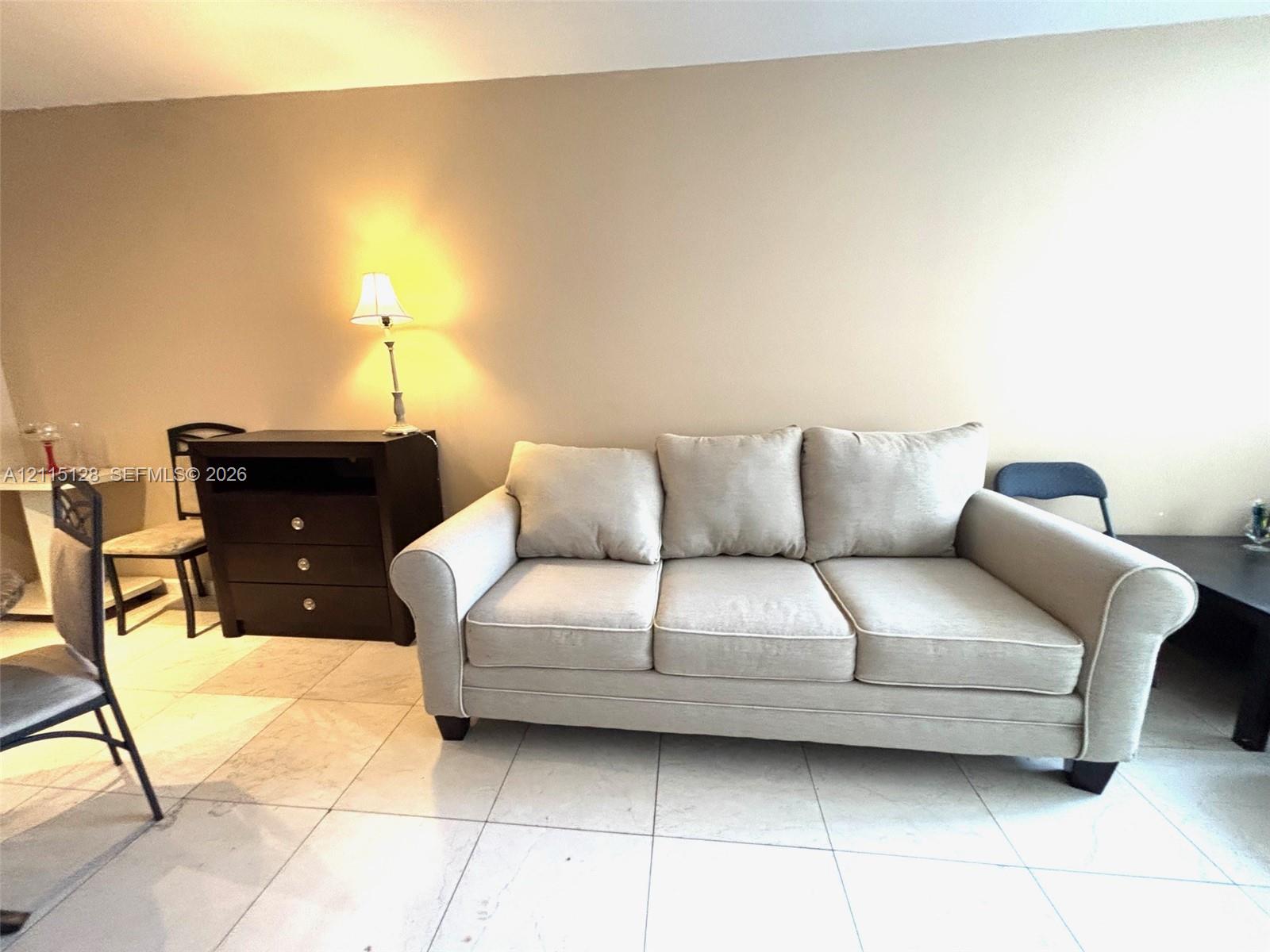 Large-format tile flooring throughout