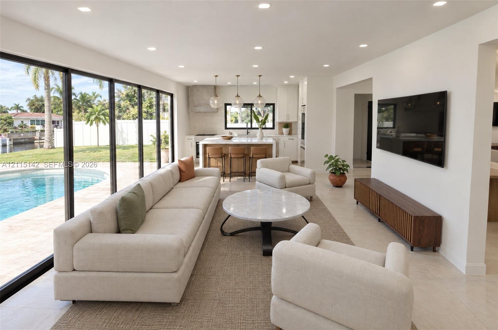 VIRTUAL RENDERING, NOT AN ACTUAL PHOTO. HOME IS UNDER CONSTRUCTION. Great room open to the pool shown as proposed per permitted plans; final construction, finishes, landscaping and furnishings may differ. Buyer to verify with developer.