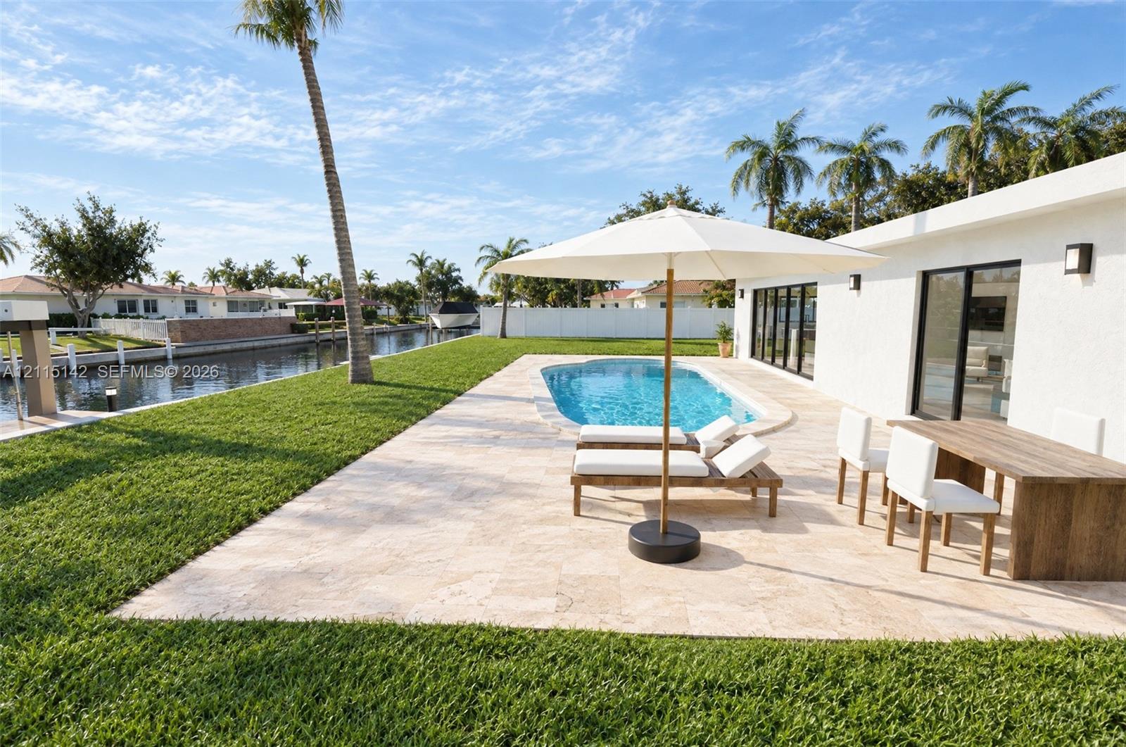 VIRTUAL RENDERING, NOT AN ACTUAL PHOTO. HOME IS UNDER CONSTRUCTION. Rear terrace and pool shown as proposed per permitted plans; final construction, finishes, landscaping and furnishings may differ. Buyer to verify with developer.