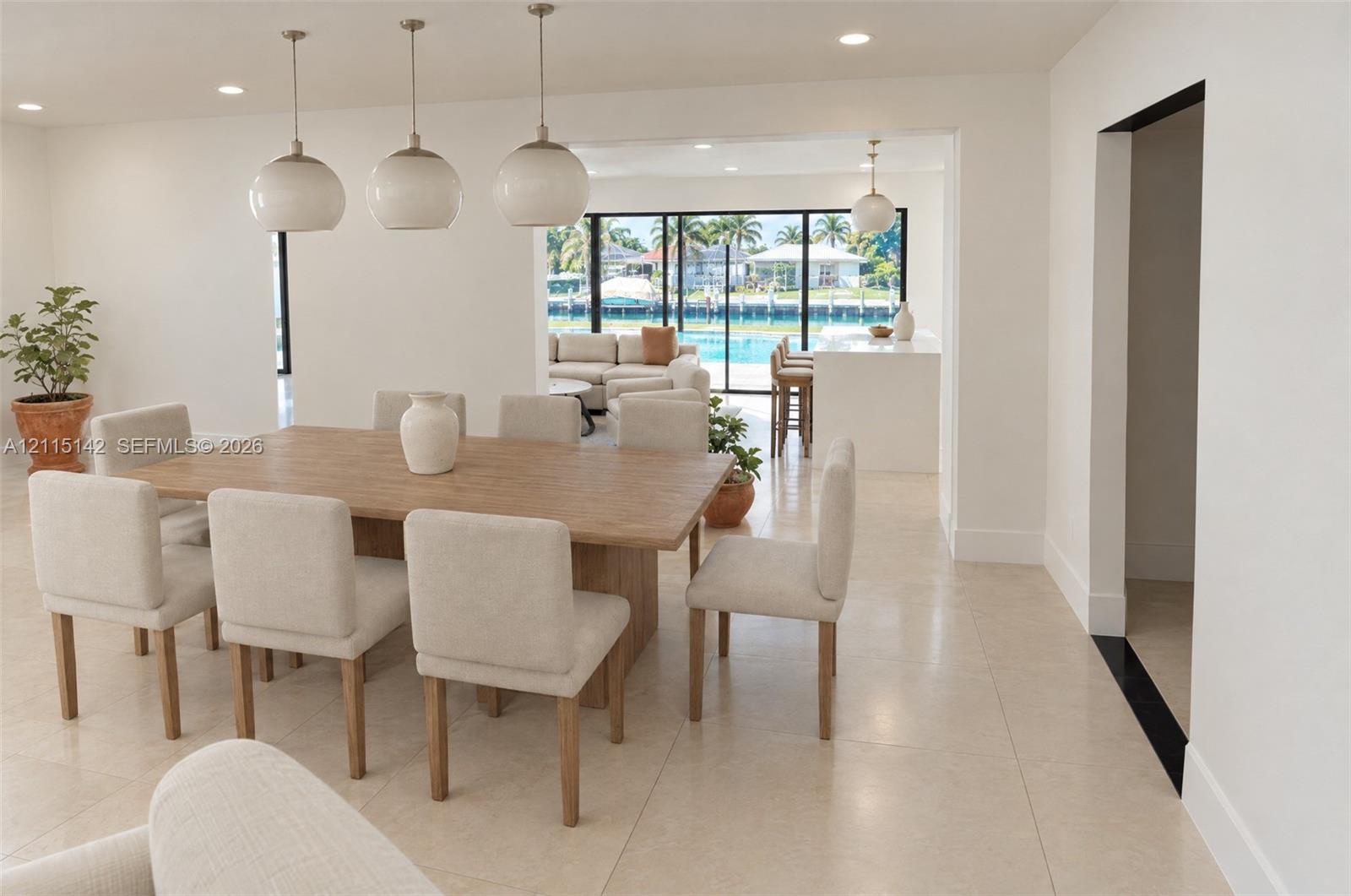 VIRTUAL RENDERING, NOT AN ACTUAL PHOTO. HOME IS UNDER CONSTRUCTION. Dining area with canal-side windows shown as proposed per permitted plans; final construction, finishes, landscaping and furnishings may differ. Buyer to verify with developer.