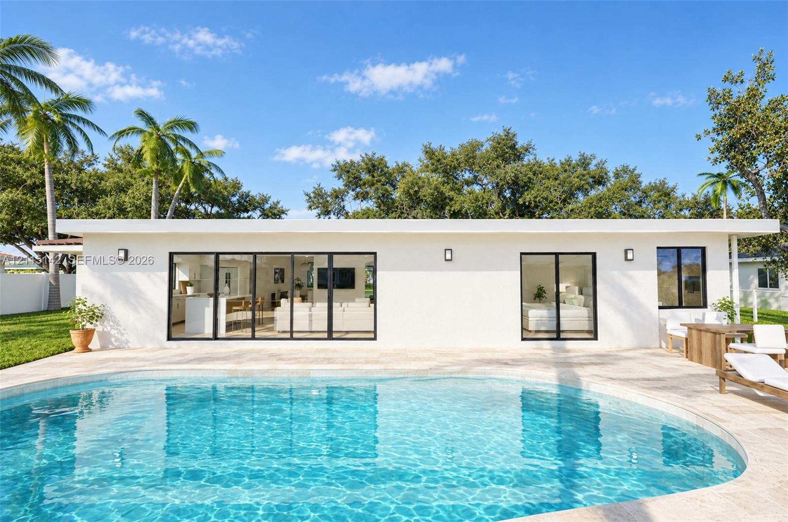 VIRTUAL RENDERING, NOT AN ACTUAL PHOTO. HOME IS UNDER CONSTRUCTION. Rear exterior and free-form pool shown as proposed per permitted plans; final construction, finishes, landscaping and furnishings may differ. Buyer to verify with developer.