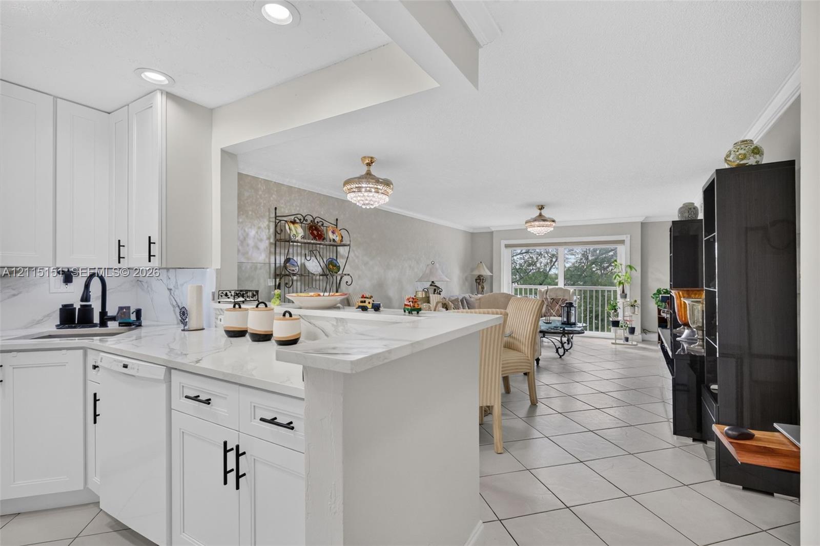 Kitchen featuring white shaker-style cabinetry, stone-surface countertops, a matte black faucet, recessed lighting, and tile flooring Kitchen featuring white shaker-style cabinetry, stone-surface countertops, a matte black faucet, recessed lighting, and tile flooring