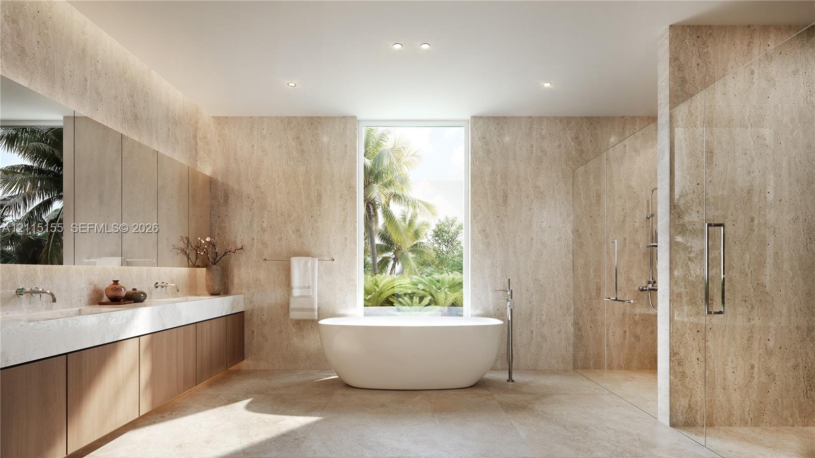 Full-height stone wall cladding, double vanity with integrated countertop, freestanding soaking tub, and walk-in glass-enclosed shower