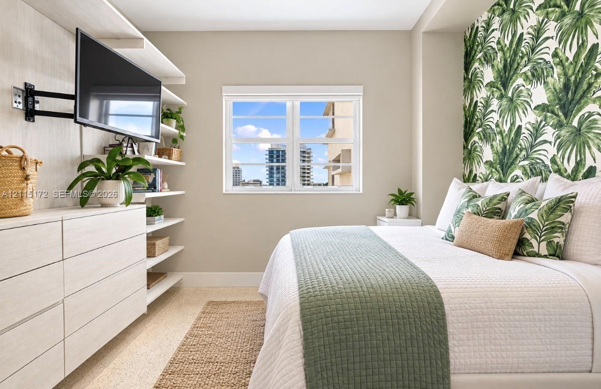 Built-in shelving unit, cabinetry with light wood-finish, and window with exterior cityscape