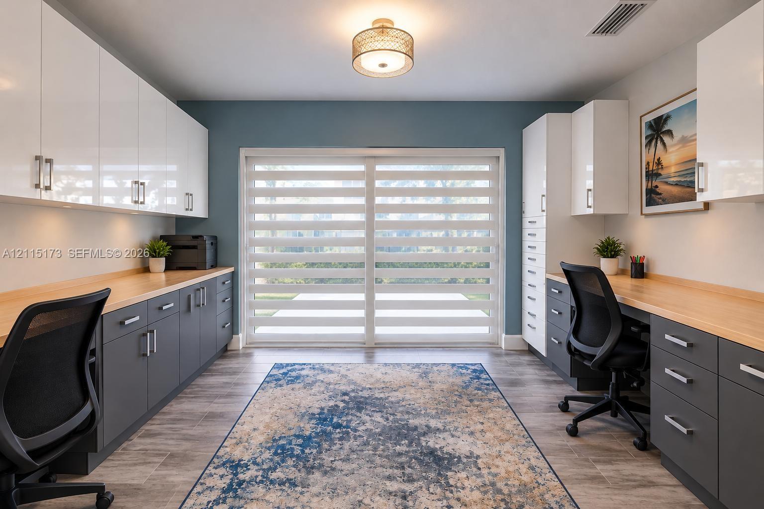 Custom built-in cabinetry with high-gloss white upper and matte grey lower storage, wood-finish countertops, tile flooring, and sliding glass doors