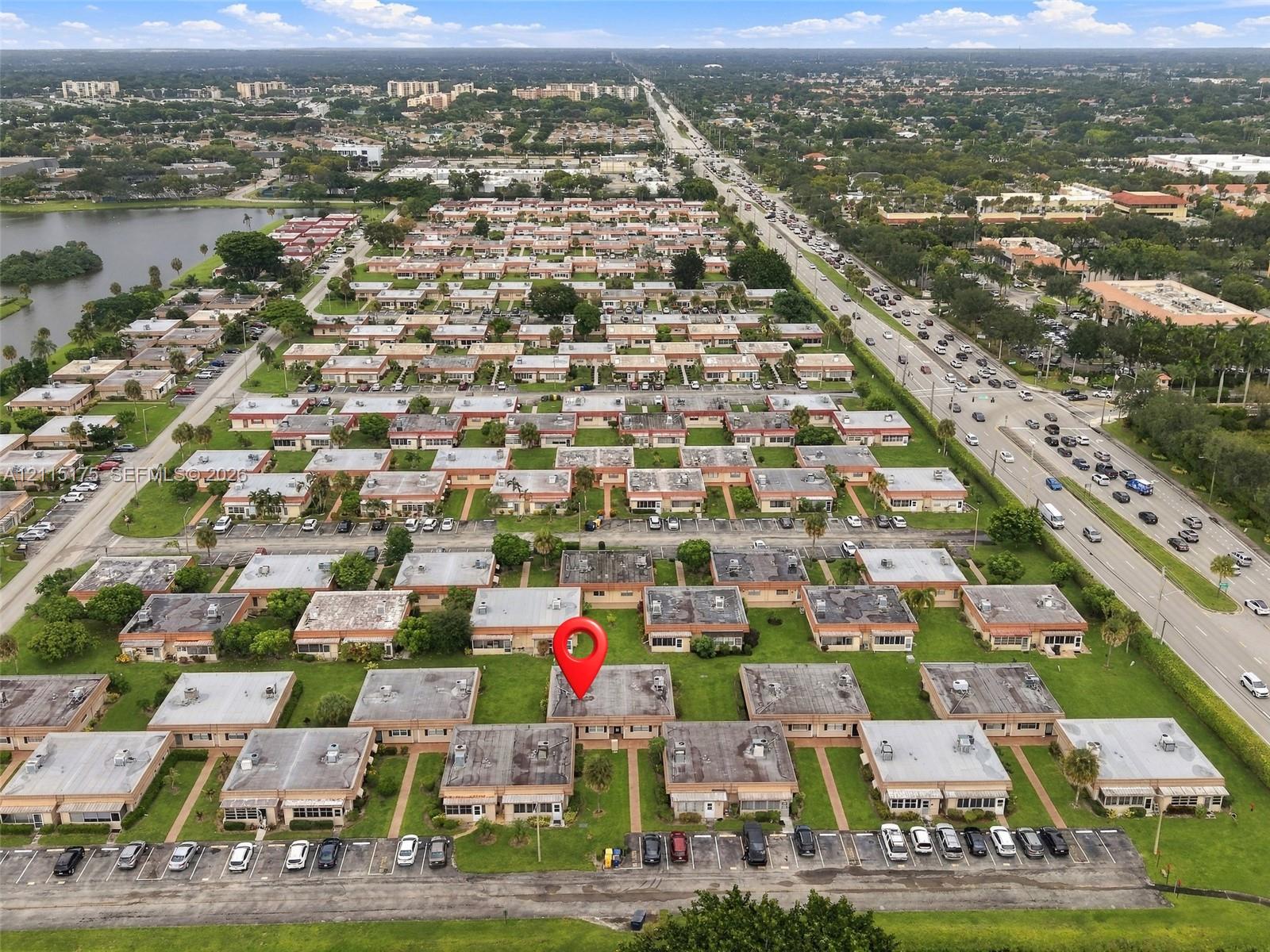 Aerial perspective of much of the Seville section with a red pin over the unit