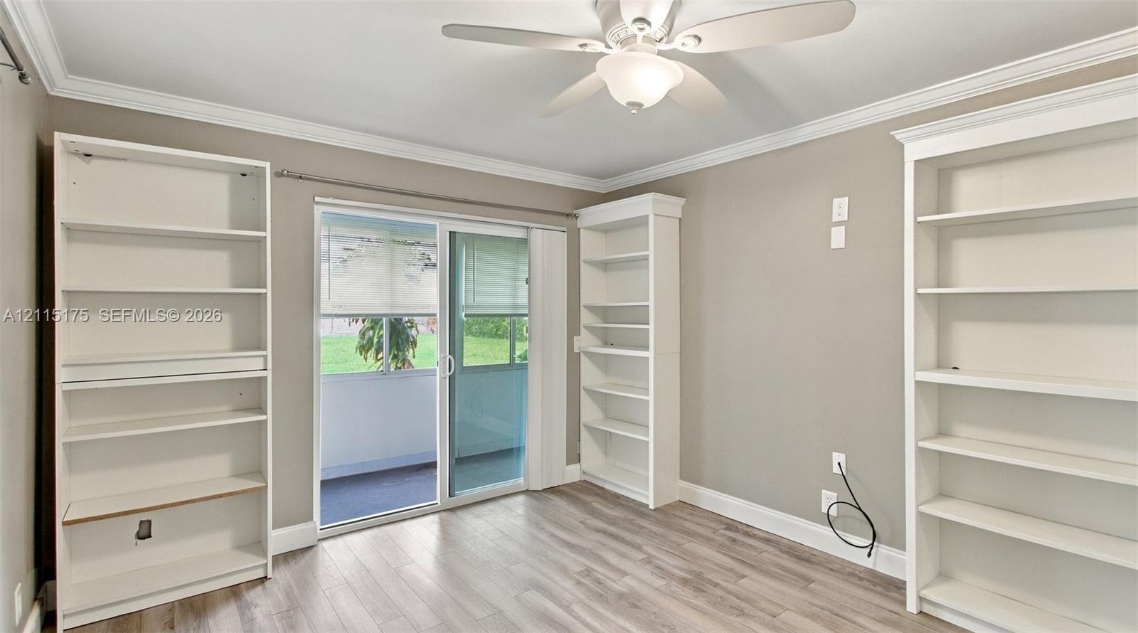 Second bedroom with sliding glass doors leading to lanai.