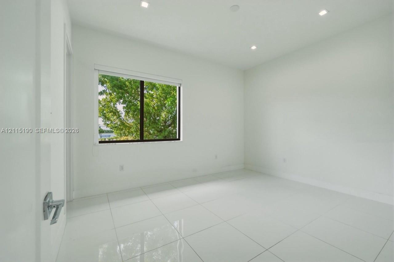 Additional room with tile flooring.