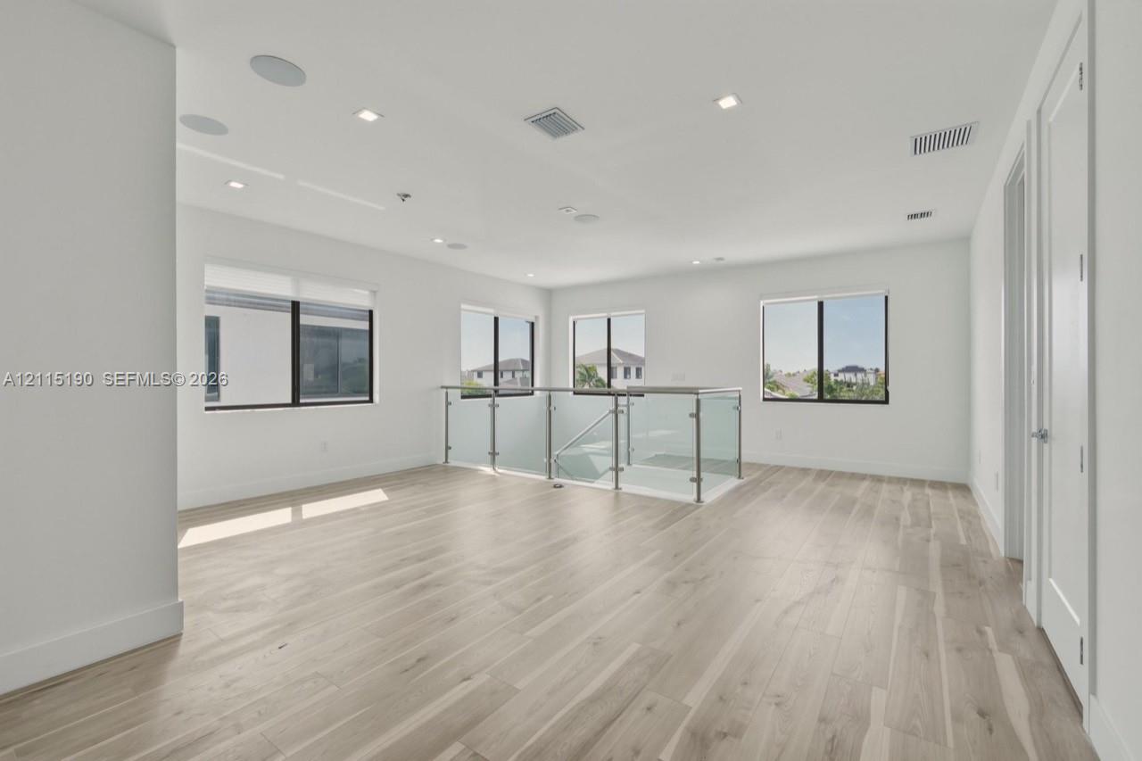 Upstairs loft and glass railing.