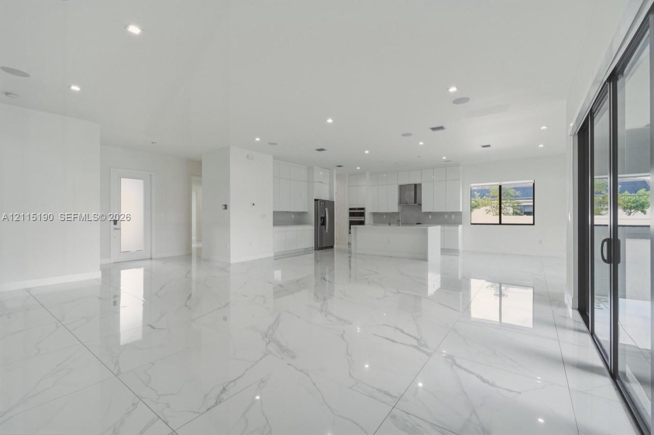 Open living area with kitchen view.